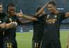 Jude Bellingham dan Vinicius Junior merayakan gol merek di laga Liga Champions antara Napoli vs Real Madrid