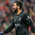 Alisson Becker dalam sebuah laga di Liverpool