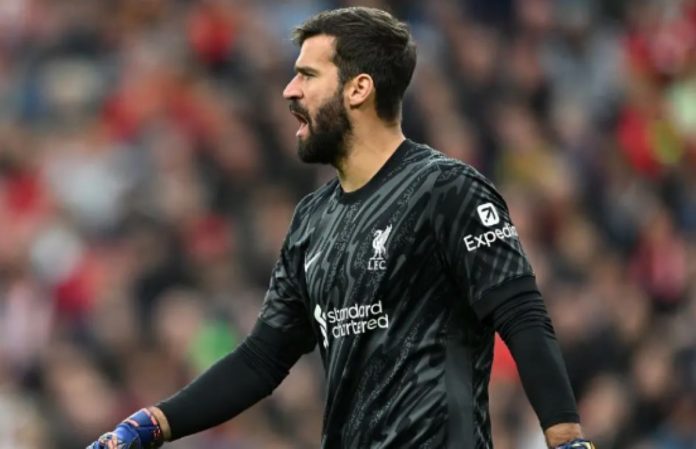 Alisson Becker dalam sebuah laga di Liverpool