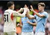 Ederson dan John Stones bertos tangan