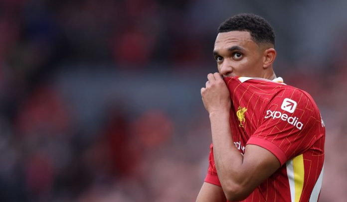 Trent Alexander-Arnold menutup mulutnya dengan jersey