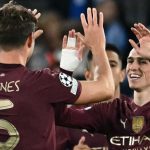 John Stones dan Phil Foden rayakan gol