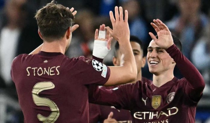 John Stones dan Phil Foden rayakan gol