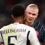 Jude Bellingham dan Erling Haaland berpelukan usai laga Real Madrid vs Manchester City di Liga Champions