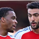 Jurrien Timber berbicara dengan Mikel Merino