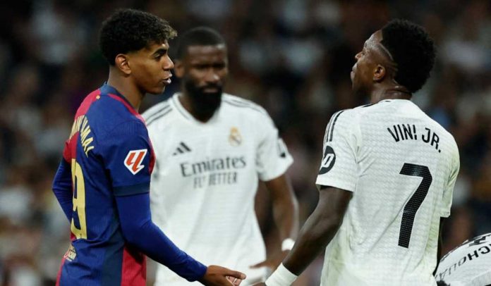 Lamine Yamal berbicara dengan Vinicius Junior di laga Barcelona melawan Real Madrid