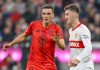 Angelo Stiller berduel dengan Joao Palhinha di laga Stuttgart vs Bayern Munchen
