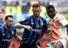 Evan Ndicka berduel dengan Marko Arnautovic di laga Inter Milan vs AS Roma