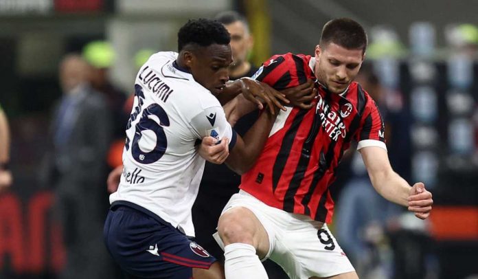 Jhon Lucumi mengawal Luka Jovic dalam duel Bologna vs AC Milan