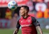 Alejandro Grimaldo menguasai bola di laga Bayer Leverkusen