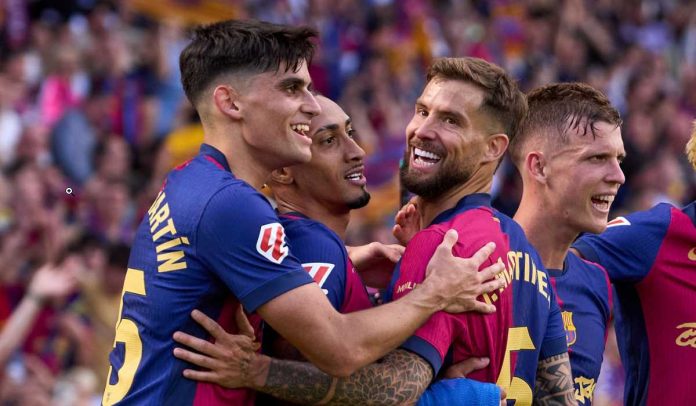 Gerard Martin merayakan gol rekan-rekannya di Barcelona