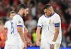Rayan Cherki tertunduk bersama Kylian Mbappe usai Spanyol mencetak gol