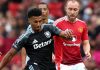 Ollie Watkins berebut bola dengan Christian Eriksen