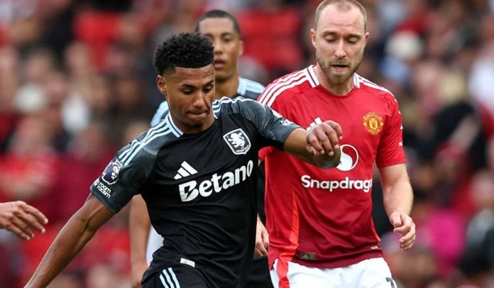 Ollie Watkins berebut bola dengan Christian Eriksen