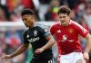 Ollie Watkins mempertahankan bola dari gangguan Harry Maguire