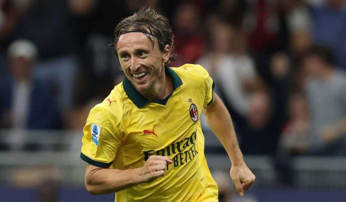 Luka Modric merayakan gol pertamanya untuk AC Milan