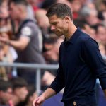 Xabi Alonso tertunduk lesu usai kekalahan Real Madrid dari Atletico Madrid
