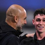 Pep Guardiola dan Phil Foden usai laga melawan Huddersfield