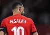 Mohamed Salah tampak dari belakang saat membela timnas Mesir di AFCON