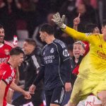 Anatoly Trubin merayakan gol di laga Benfica vs Real Madrid di Liga Champions