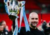 Pep Guardiola dan trofi Carabao Cup atau Piala Liga