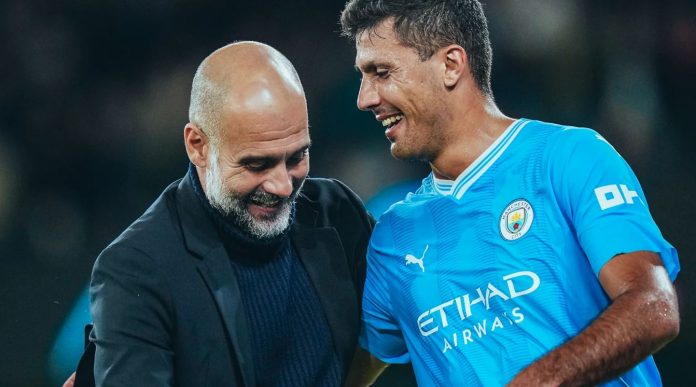 Pep Guardiola dan Rodri Pep Guardiola dan Rodri